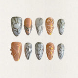 Radiant Spiral nails showcase vivid gradient shades of orange and pink, with circular patterns and shimmering accents, exuding energy and vibrancy.