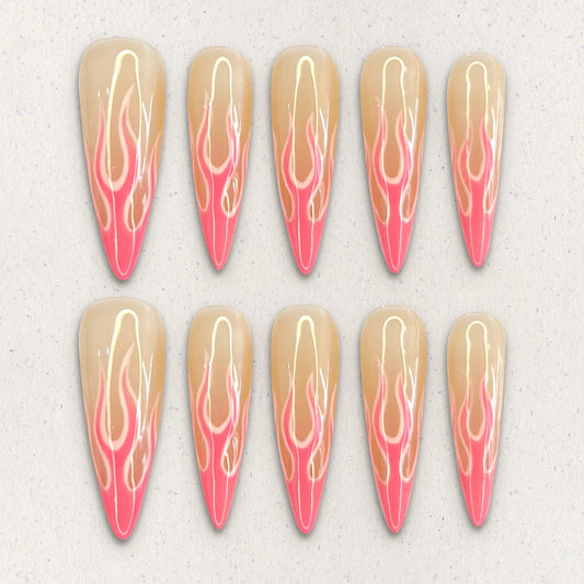 Flaming Elegance nail set features fiery flame patterns in soft coral and peach tones, evoking warmth and sophistication in every detail.