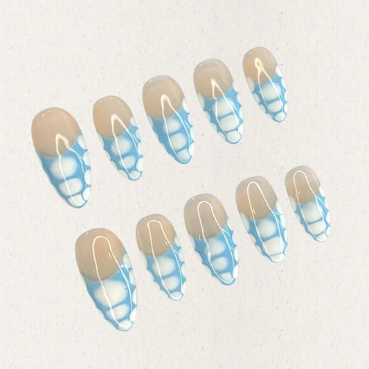 Porcelain Grace press-on nails with a beige base and intricate blue-and-white geometric details. Inspired by the artistry of classic porcelain, this design adds a touch of refinement to your look.