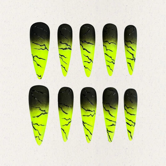 Electric Surge nail set includes neon green and black gradients with bold lightning effects, offering a dynamic and energetic appearance.