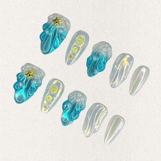 This set of press-on nails, titled "Celestial Waves," features flowing ocean-inspired blue patterns, accented by iridescent pearl white and golden star embellishments. Each nail has a distinct design, including wave-like swirls, translucent gradients, and metallic highlights. The combination creates a serene, celestial look with a minimalist and artistic feel.