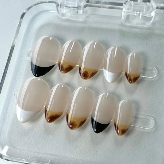 Coffee Blend nail set highlights a gradient of coffee-inspired hues transitioning from deep brown to creamy white, creating a cozy and stylish appearance.