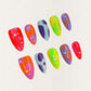 Colorful press-on nails with neon abstract patterns, featuring playful dots and fluid shapes in vivid hues.