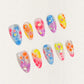 Vibrant press-on nails with dynamic abstract designs in red, orange, and yellow tones, featuring bold, swirling patterns for an energetic look.