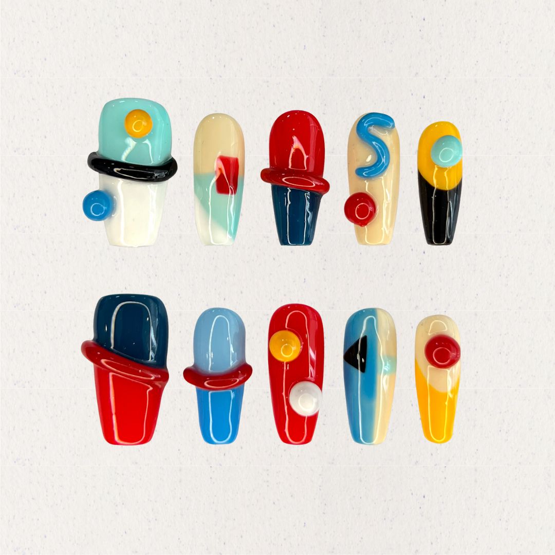 Modern Art press-on nails featuring geometric shapes and vibrant color blocks for a striking, artistic vibe.