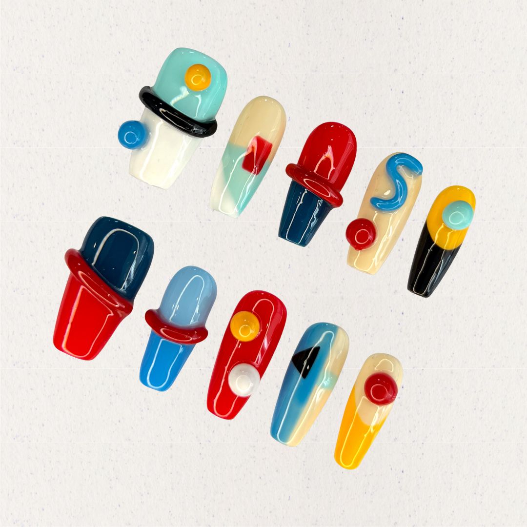 Modern Art press-on nails featuring geometric shapes and vibrant color blocks for a striking, artistic vibe.