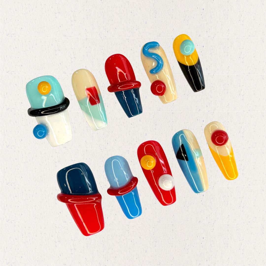 Modern Art press-on nails featuring geometric shapes and vibrant color blocks for a striking, artistic vibe.