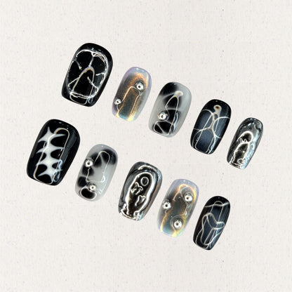 Galactic Vibes press-on nails featuring galaxy swirls and star patterns for an out-of-this-world appearance.