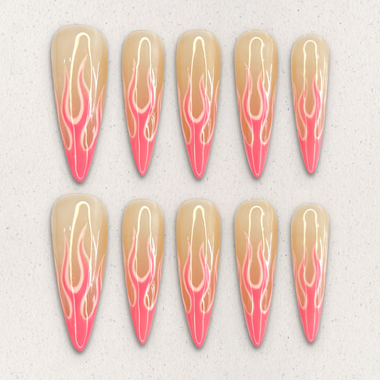 Flaming Elegance nail set features fiery flame patterns in soft coral and peach tones, evoking warmth and sophistication in every detail.