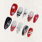 Radiant Blaze nail set showcases striking red and black tones with silver metallic accents and dynamic, flame-like patterns, evoking the energy of a blazing fire.