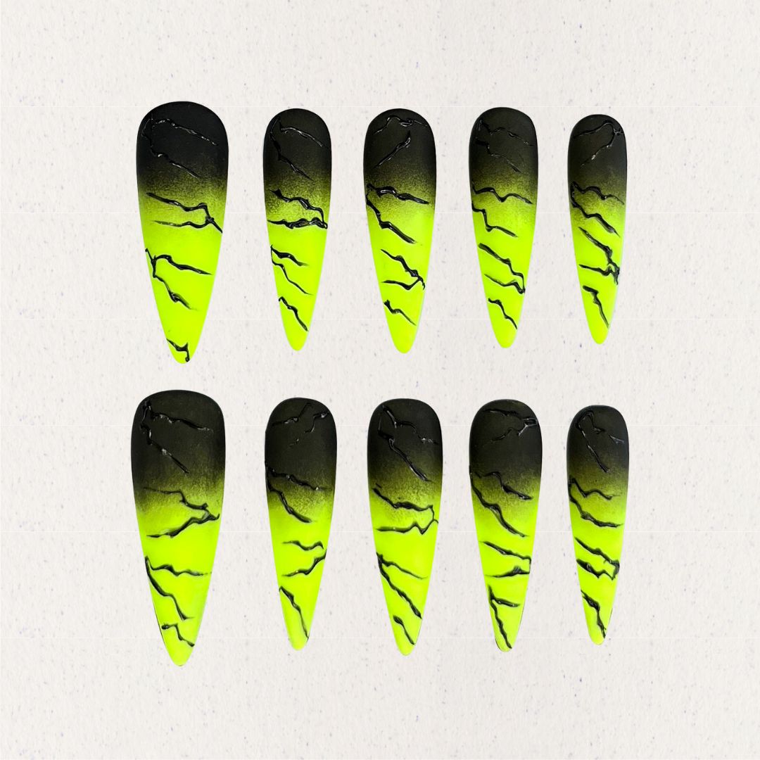 Electric Surge nail set includes neon green and black gradients with bold lightning effects, offering a dynamic and energetic appearance.