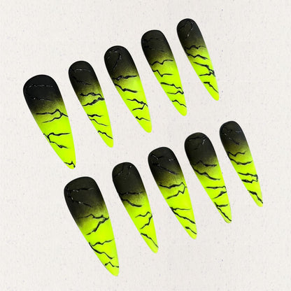 Electric Surge nail set includes neon green and black gradients with bold lightning effects, offering a dynamic and energetic appearance.