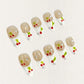 Cherry Charm press-on nails featuring delicate cherry designs on a glossy nude and white base, enhanced with sparkling rhinestones for a cheerful and vibrant aesthetic.