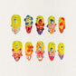 Blooming Fiesta nail set features a bright yellow base with vivid 3D flowers and rhinestones, creating a bold and celebratory floral design.