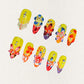 Blooming Fiesta nail set features a bright yellow base with vivid 3D flowers and rhinestones, creating a bold and celebratory floral design.
