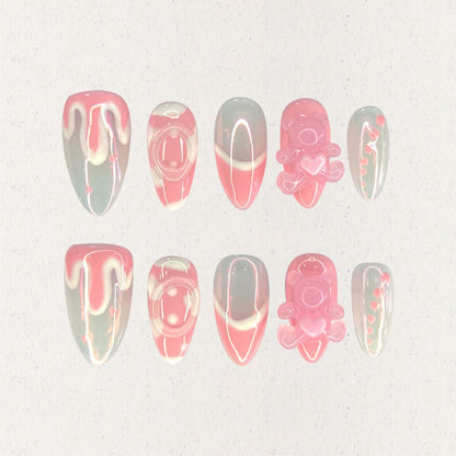 Sweet Whimsy nail set showcases a blend of soft pink and white tones, with smooth curves and 3D teddy bear embellishments. This design evokes a sense of nostalgia and playful joy, perfect for a whimsical touch.