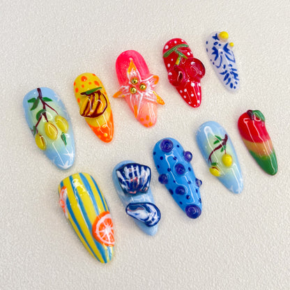 A lively set of press-on nails featuring vibrant fruit designs like lemons, bananas, and strawberries, capturing the essence of a tropical paradise in a fun, colorful style.