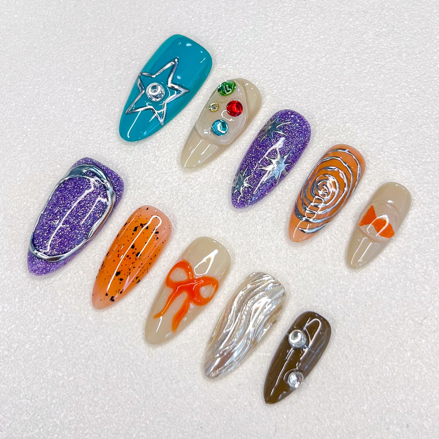 Cosmic Journey press-on nails featuring a space-inspired design with stars, planets, and metallic accents, creating an out-of-this-world look.