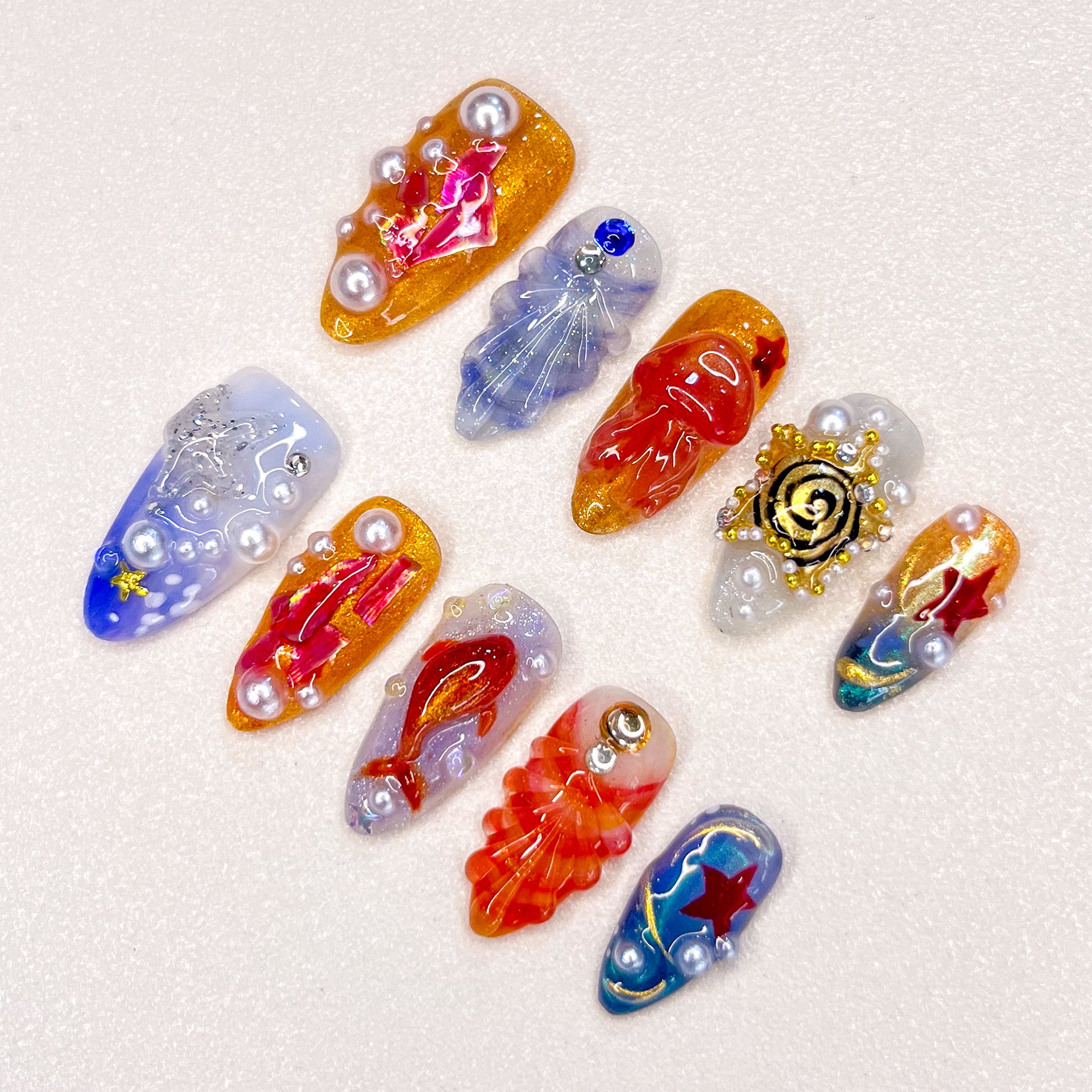 Experience the beauty of the ocean with the Oceanic Wonders wearable nails. Featuring pearls, shells, and starfish, this set offers a delicate 3D design perfect for parties, travel, or everyday wear, adding a unique flair to your nails.