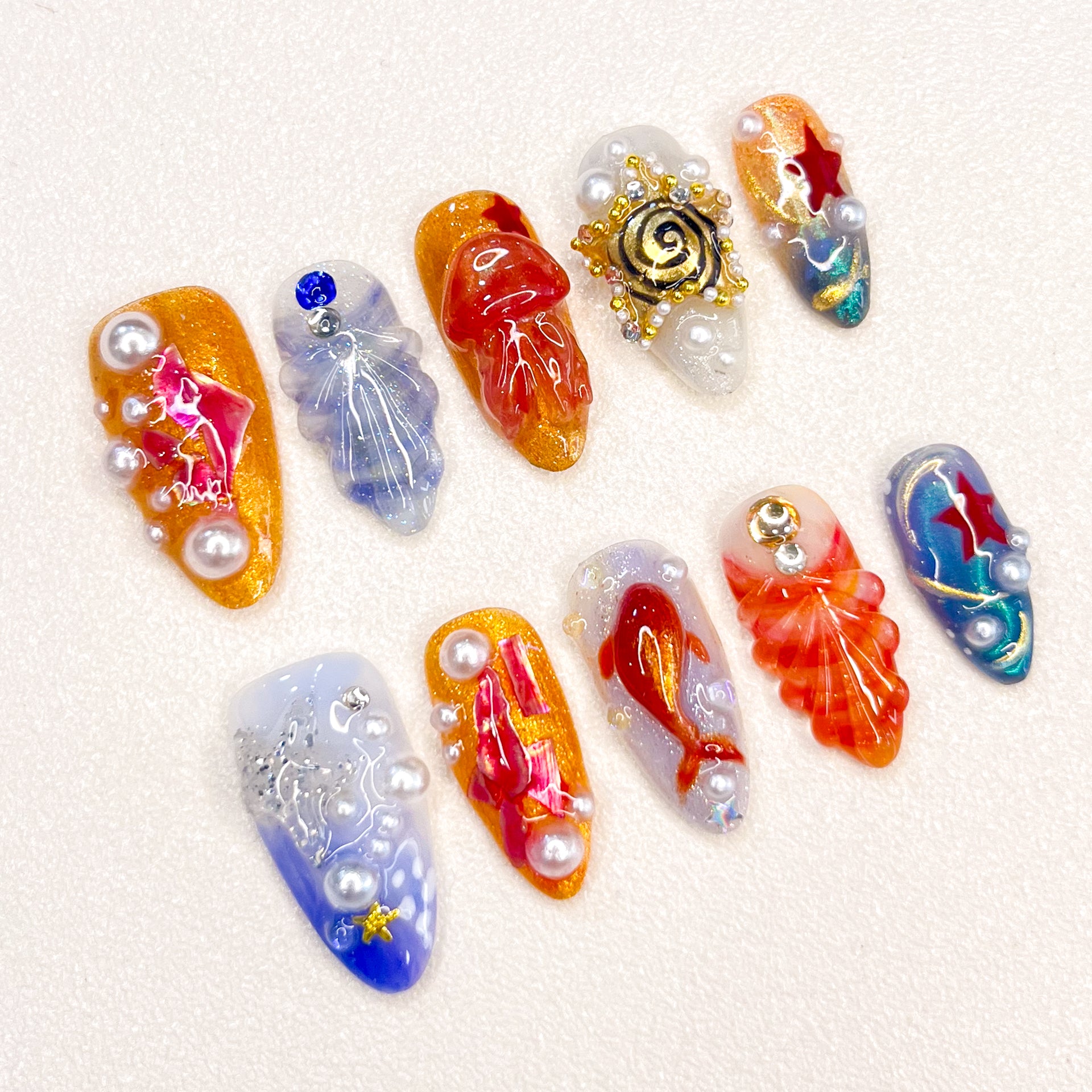 Experience the beauty of the ocean with the Oceanic Wonders wearable nails. Featuring pearls, shells, and starfish, this set offers a delicate 3D design perfect for parties, travel, or everyday wear, adding a unique flair to your nails.