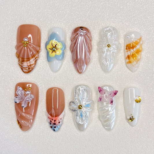 Flutter Fantasy press-on nails with 3D butterflies and delicate flower details, capturing the essence of blooming seasons.