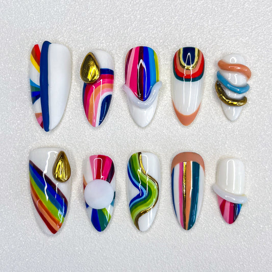 Rainbow Radiance press-on nails with colorful stripes and bold patterns, perfect for a lively and dynamic look.