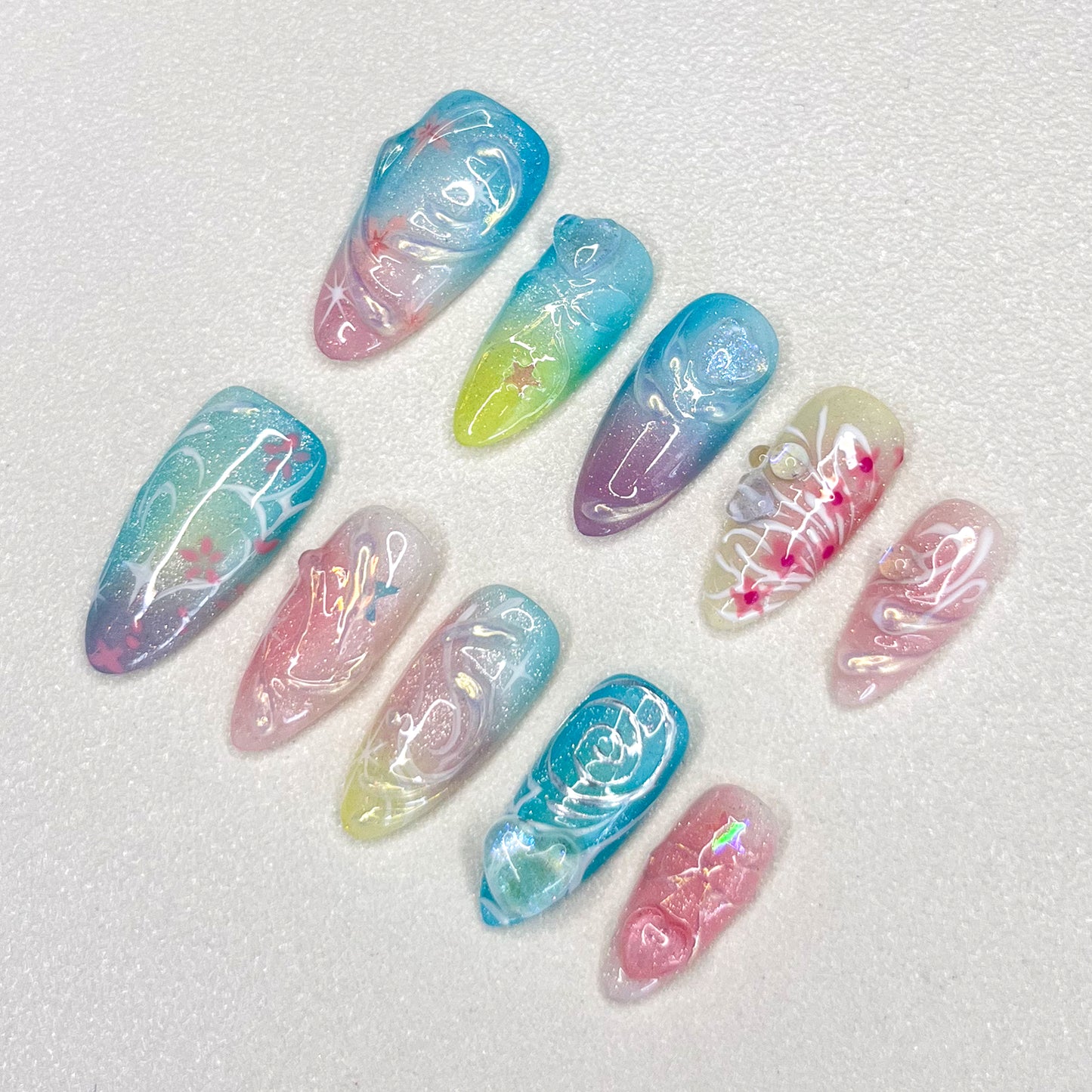 Celestial Waves press-on nails with soft gradients and stardust patterns, creating a magical, otherworldly effect.