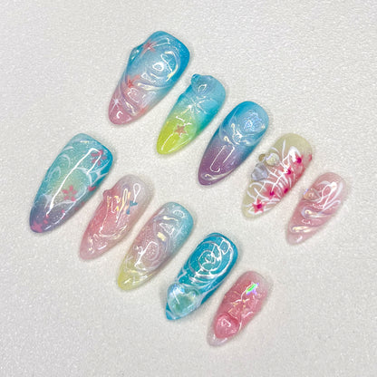 Celestial Waves press-on nails with soft gradients and stardust patterns, creating a magical, otherworldly effect.