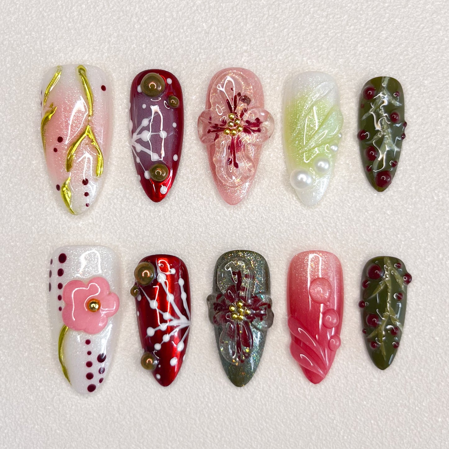 Enchanted Garden press-on nails with hand-painted florals and foliage, perfect for those who love nature-inspired designs.