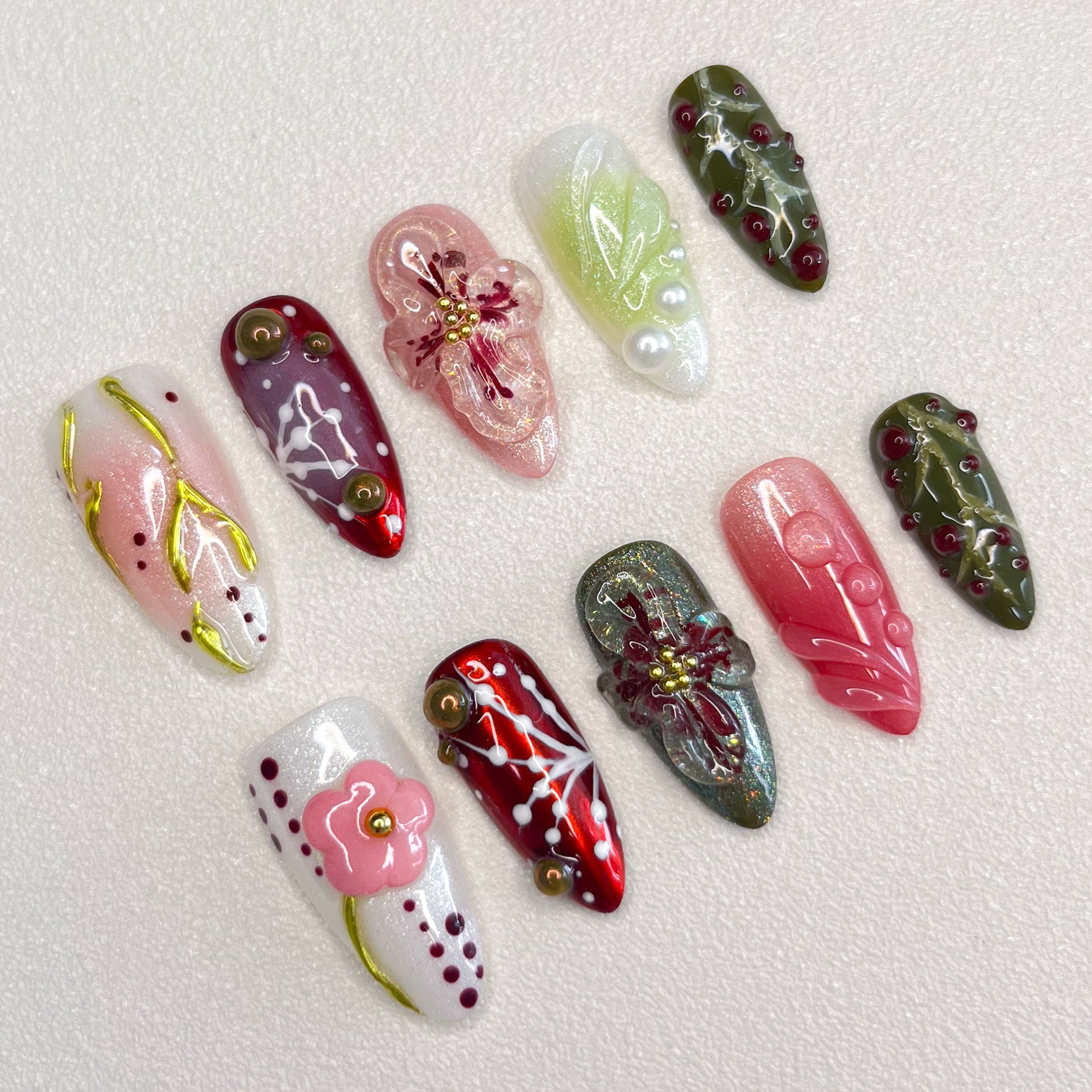 Enchanted Garden press-on nails with hand-painted florals and foliage, perfect for those who love nature-inspired designs.