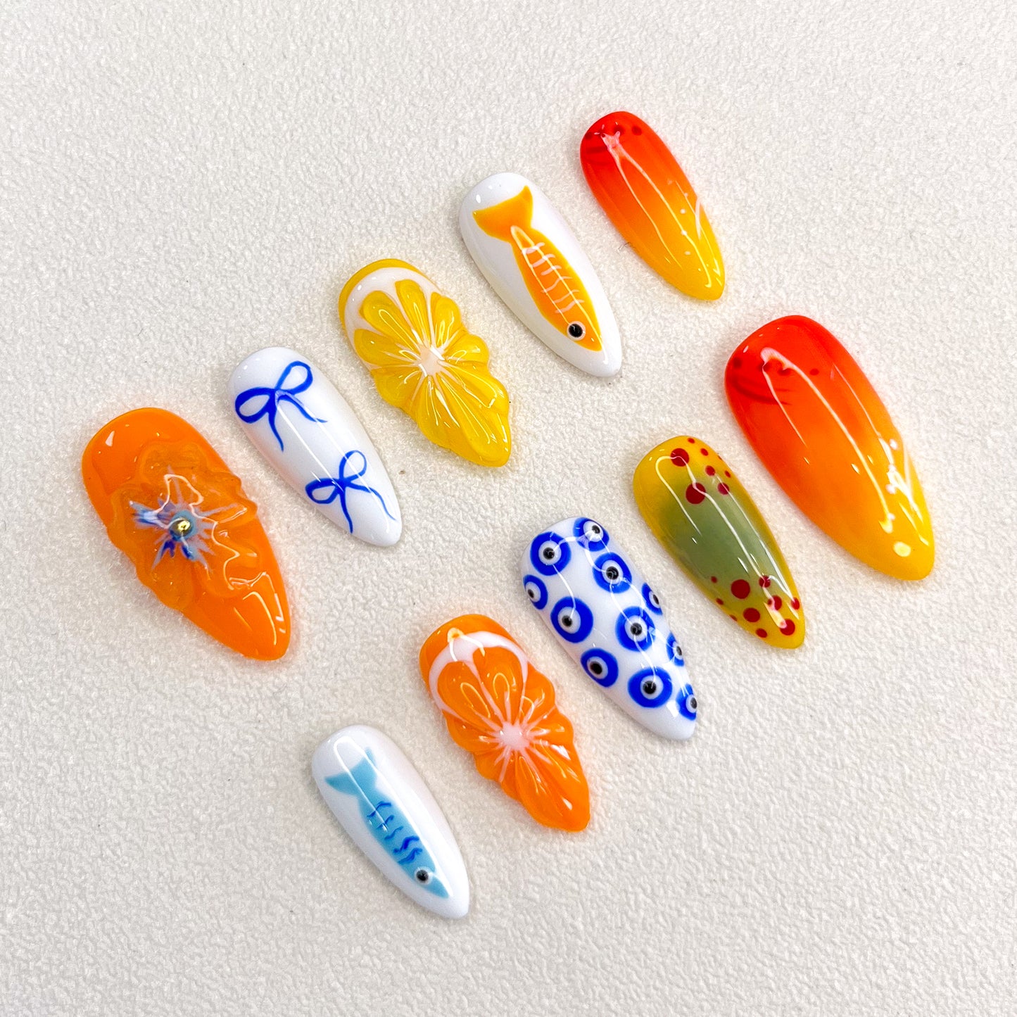 Tropical Sunrise press-on nails with bright orange and yellow designs, inspired by sunny beaches and tropical getaways.