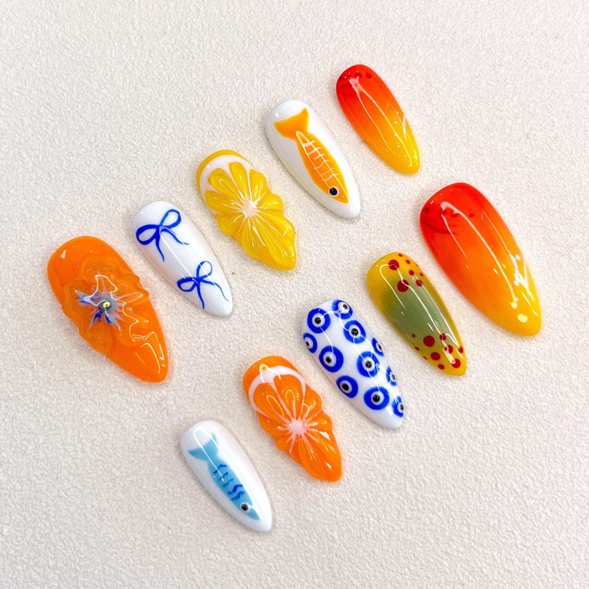 Tropical Sunrise press-on nails with bright orange and yellow designs, inspired by sunny beaches and tropical getaways.