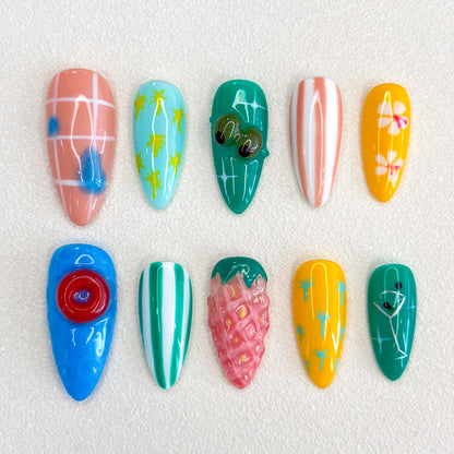 Paradise Vibes press-on nails featuring tropical fruit designs, palm leaves, and vibrant patterns for a fun, vacation-ready style.