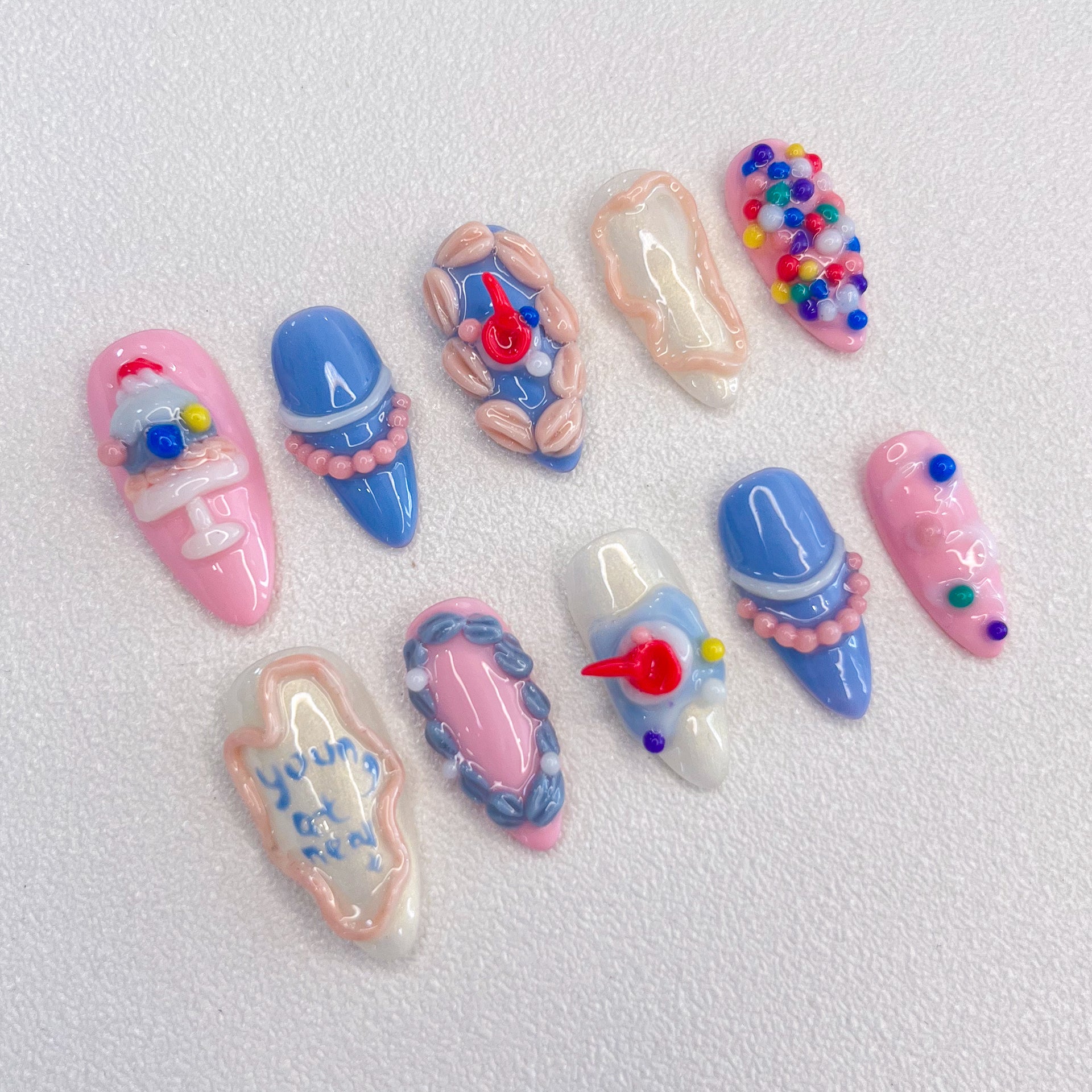 Candyland Dreams press-on nails with colorful beads and pastel accents, inspired by playful candy themes for a sweet, joyful vibe.