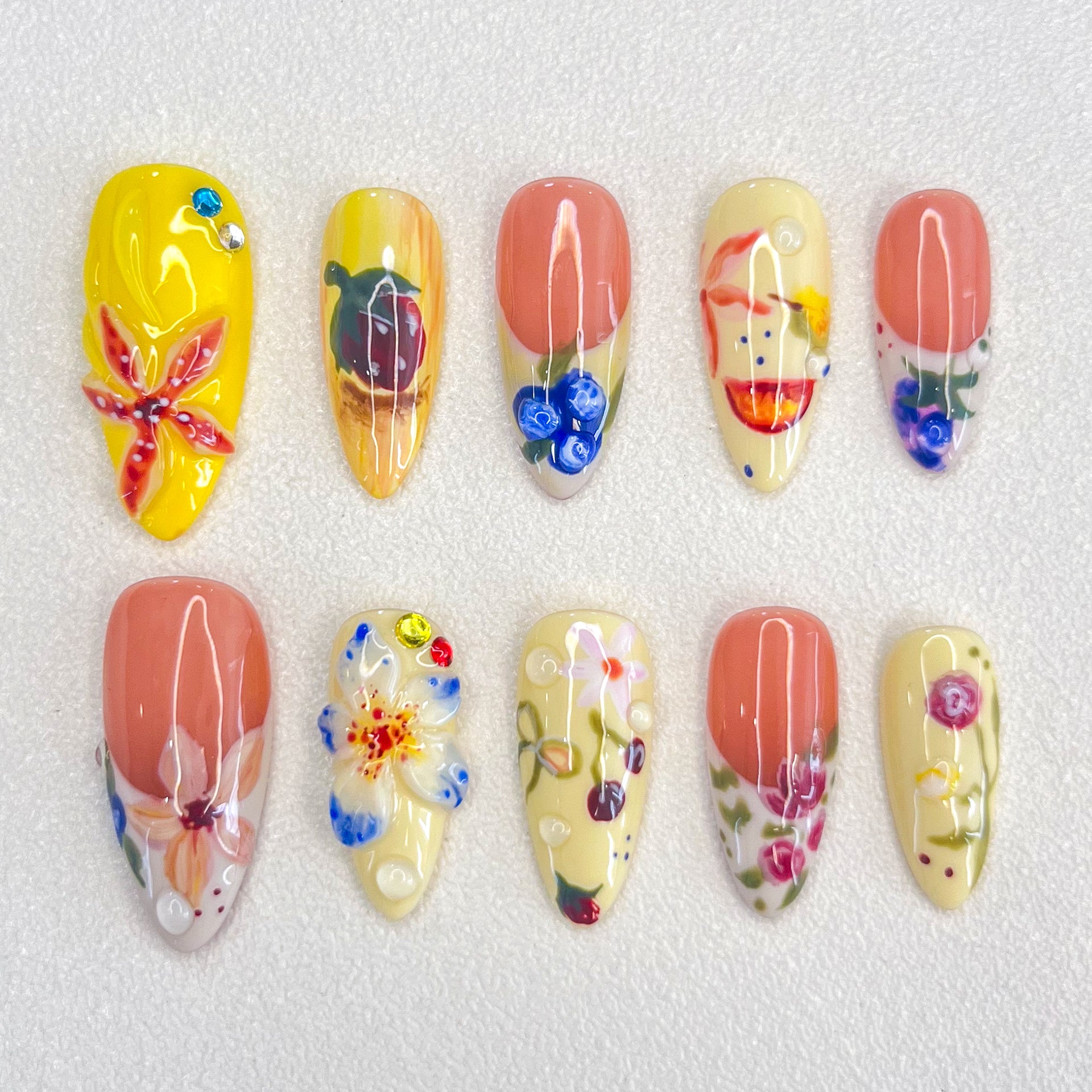 Garden Party press-on nails with colorful flowers and leaves, perfect for capturing the lively spirit of a blooming garden.