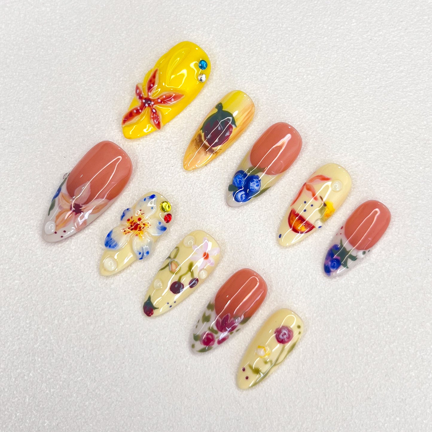 Garden Party press-on nails with colorful flowers and leaves, perfect for capturing the lively spirit of a blooming garden.