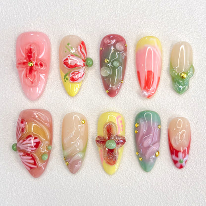 Floral Fantasy press-on nails with 3D flower designs and pastel shades, capturing the essence of a blooming garden.