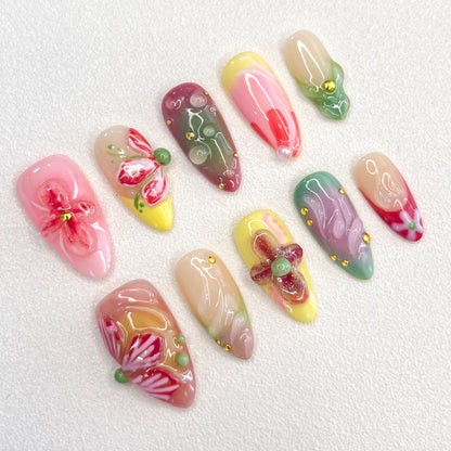 Floral Fantasy press-on nails with 3D flower designs and pastel shades, capturing the essence of a blooming garden.