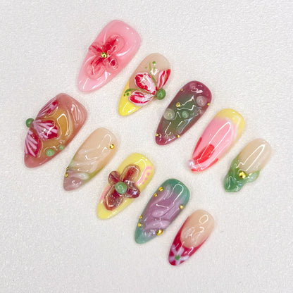 Floral Fantasy press-on nails with 3D flower designs and pastel shades, capturing the essence of a blooming garden.