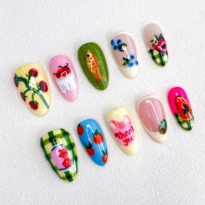 Garden Delight press-on nails with colorful fruit and flower patterns, perfect for a fresh and vibrant look.