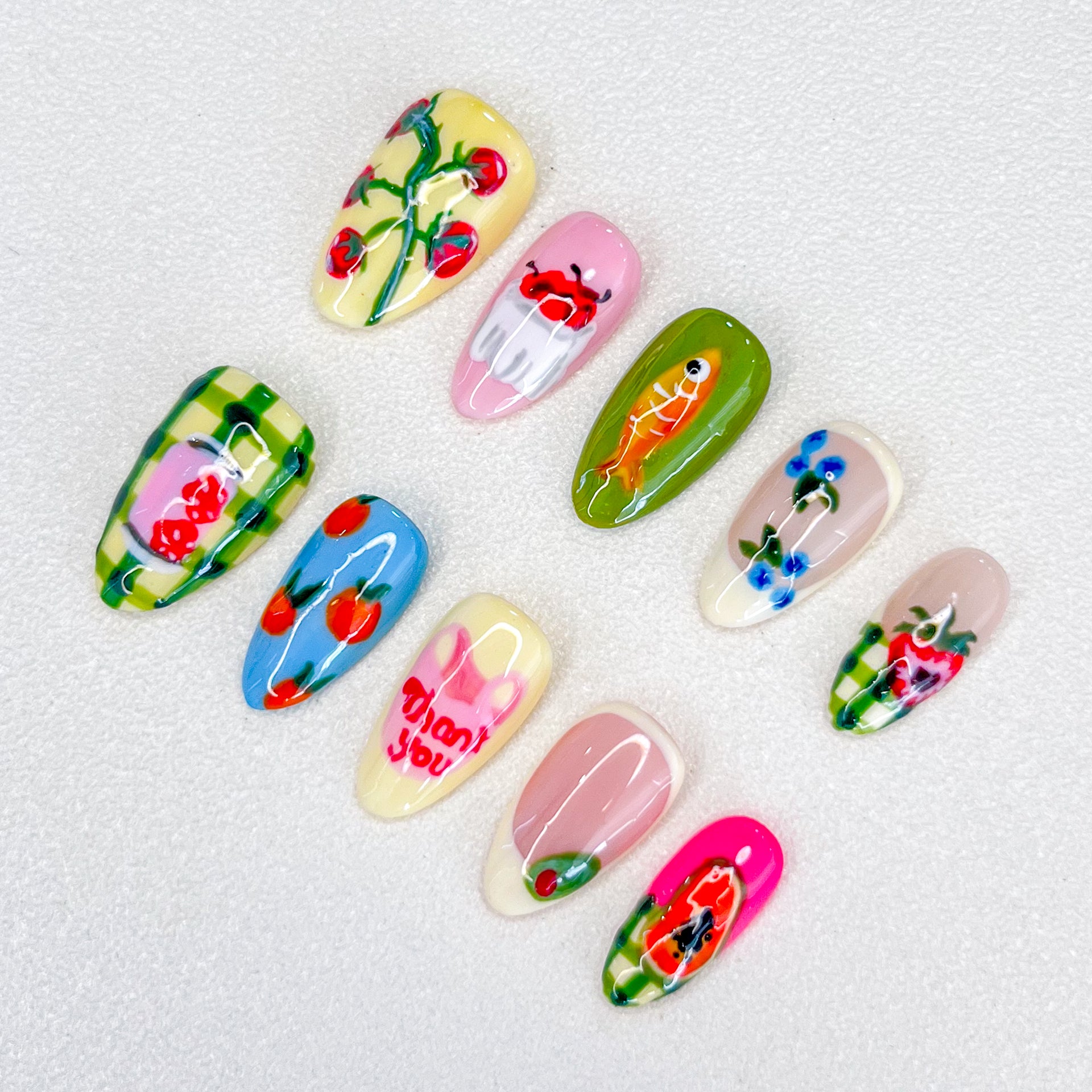 Garden Delight press-on nails with colorful fruit and flower patterns, perfect for a fresh and vibrant look.