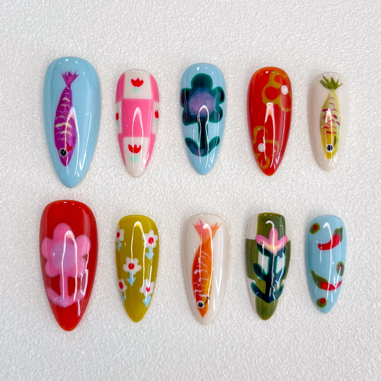 Koi Serenity press-on nails with koi fish and floral patterns in vibrant colors, inspired by Japanese art.