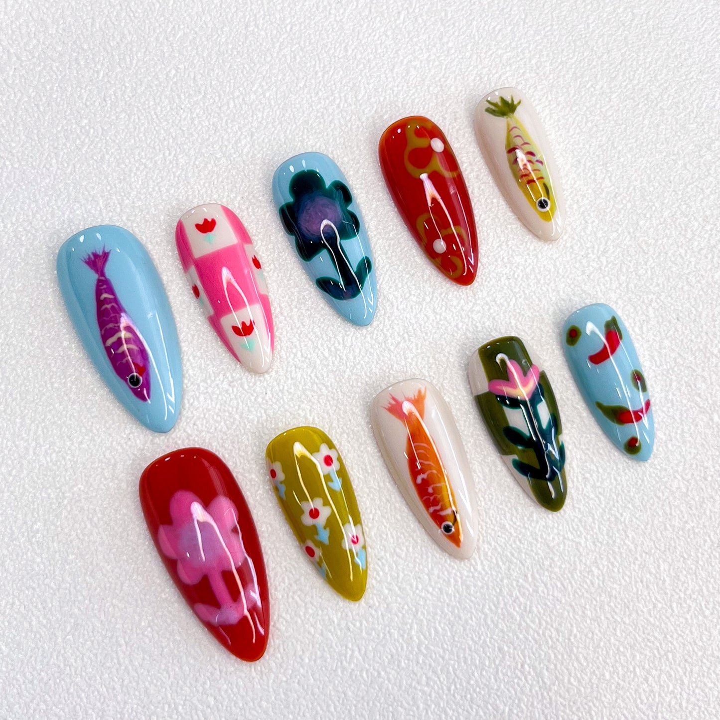 Koi Serenity press-on nails with koi fish and floral patterns in vibrant colors, inspired by Japanese art.