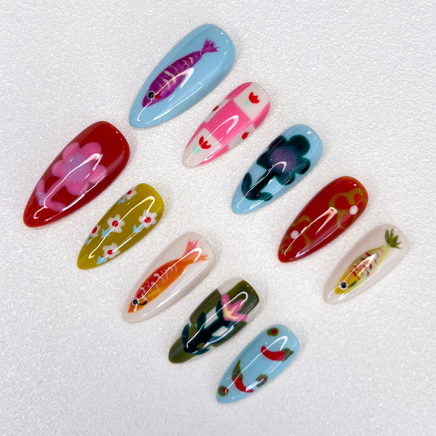 Koi Serenity press-on nails with koi fish and floral patterns in vibrant colors, inspired by Japanese art.