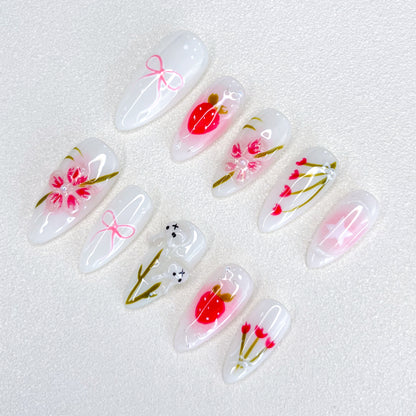 Cherry Blossom Bliss press-on nails with soft pink tones and cherry blossom designs, evoking the beauty of springtime.