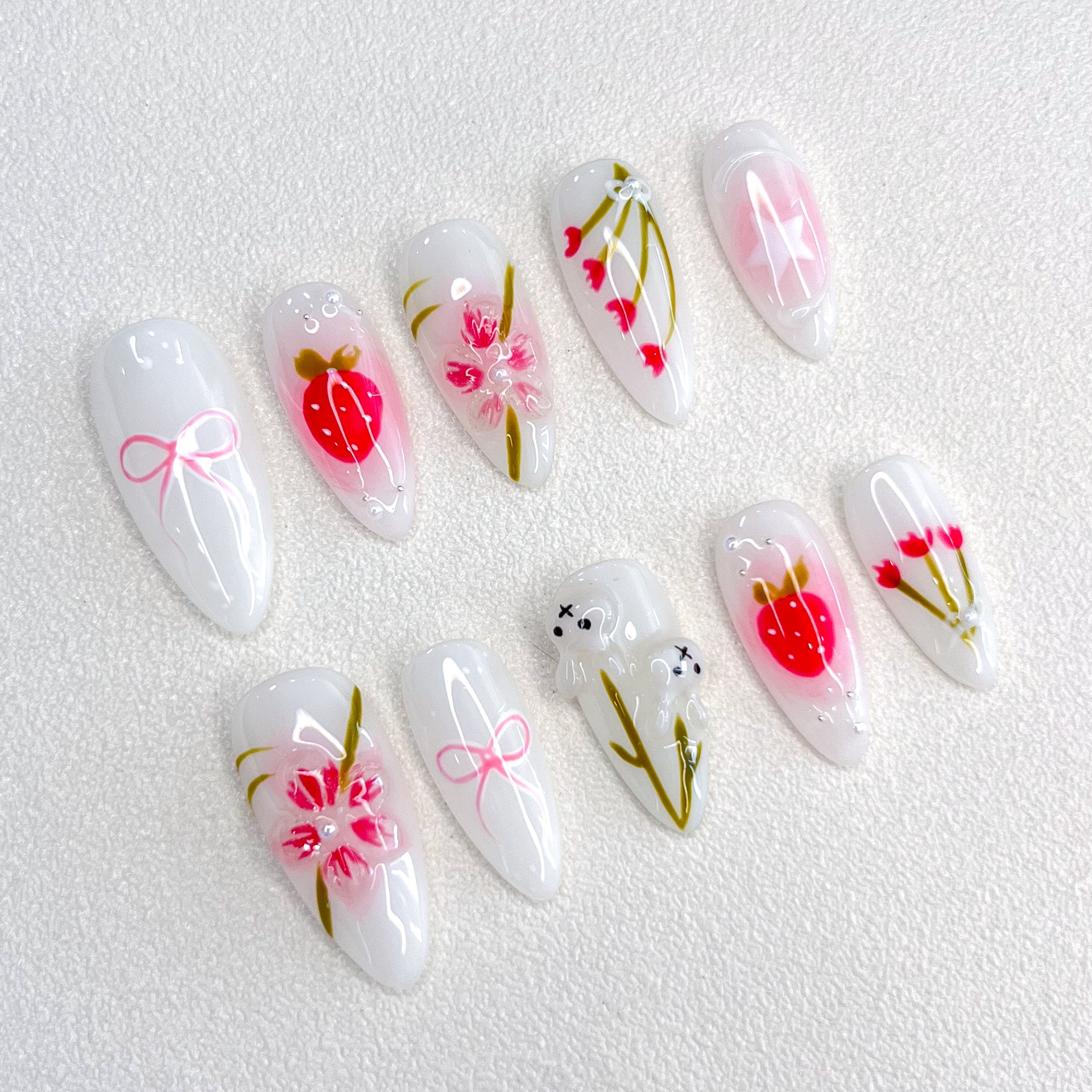 Cherry Blossom Bliss press-on nails with soft pink tones and cherry blossom designs, evoking the beauty of springtime.