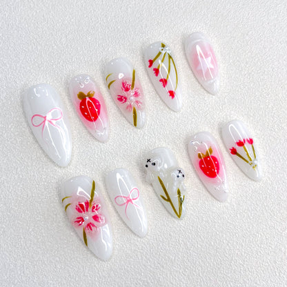 Cherry Blossom Bliss press-on nails with soft pink tones and cherry blossom designs, evoking the beauty of springtime.