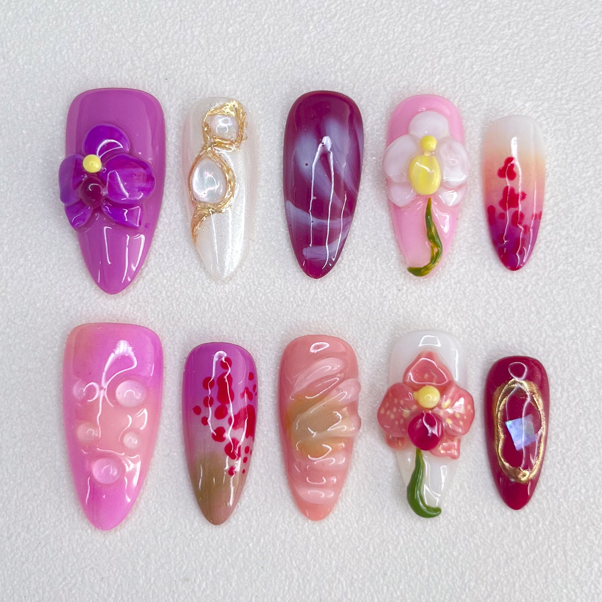 Orchid Elegance press-on nails with rich purple shades and orchid details, perfect for a refined floral look.