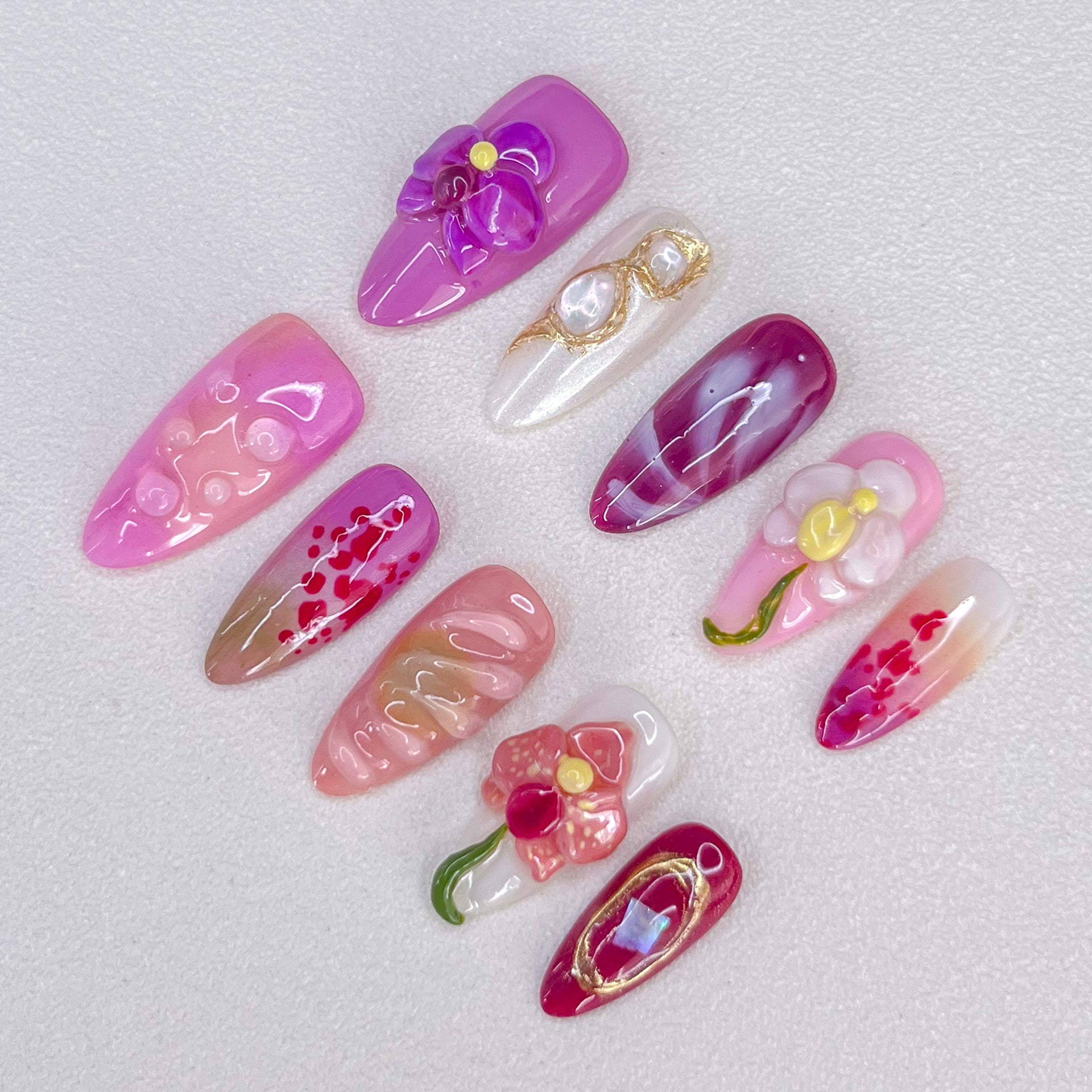 Orchid Elegance press-on nails with rich purple shades and orchid details, perfect for a refined floral look.