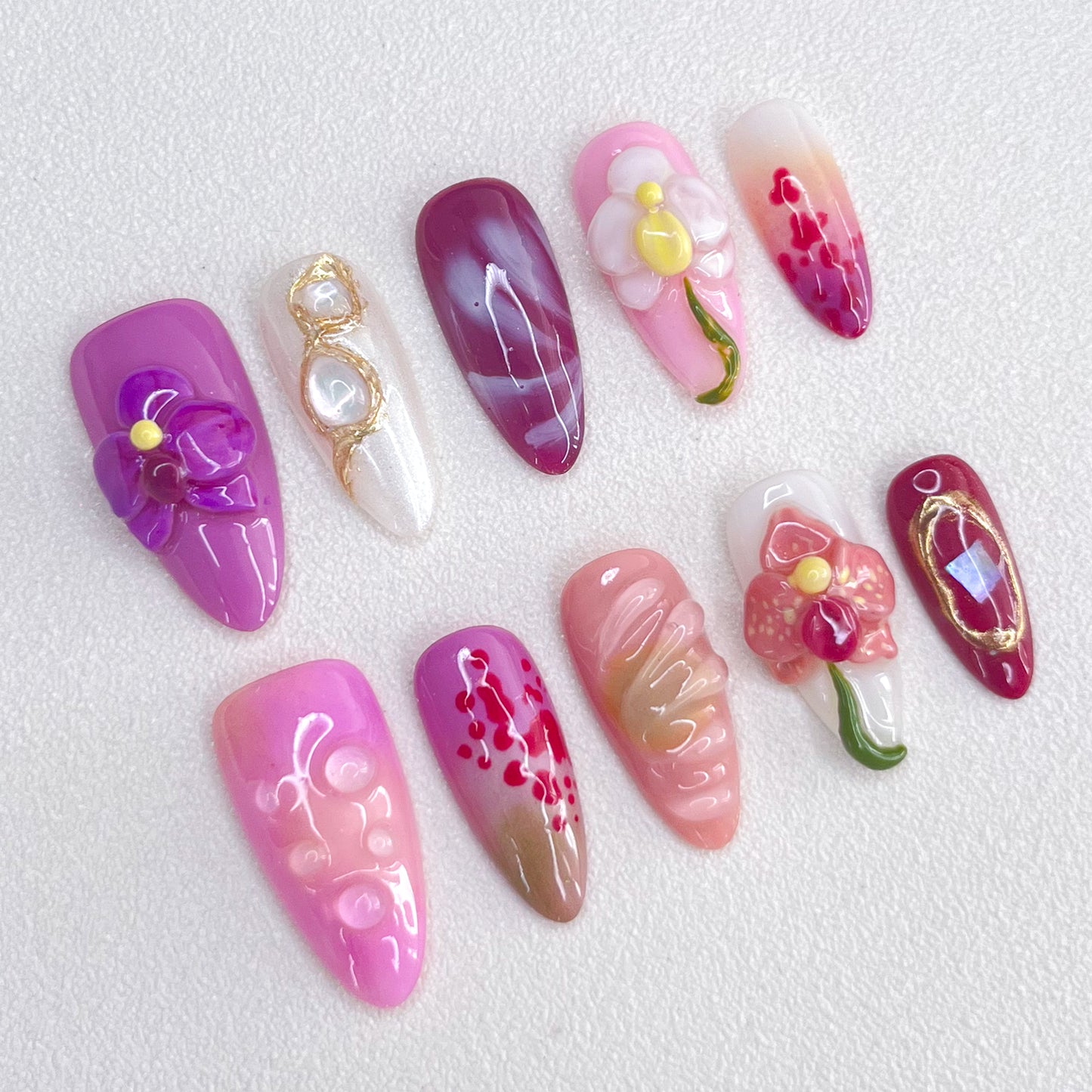 Orchid Elegance press-on nails with rich purple shades and orchid details, perfect for a refined floral look.